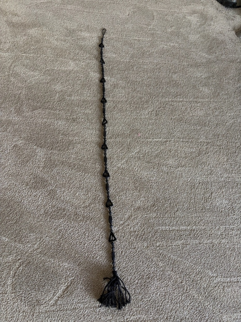 Anthropologie black wall hanging